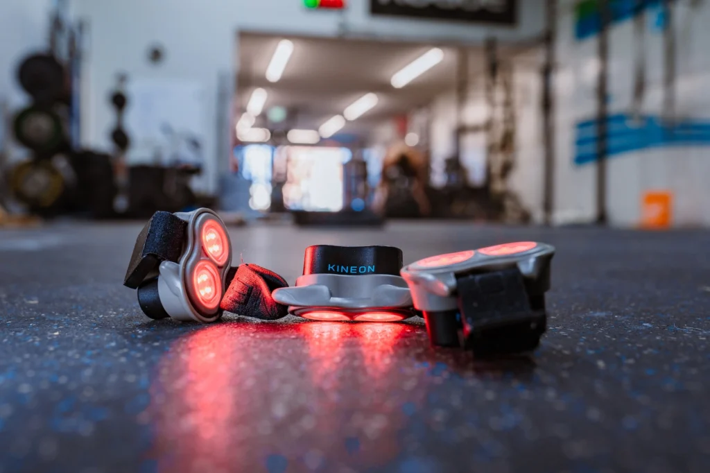 Kineon red light therapy device on the floor in a gym