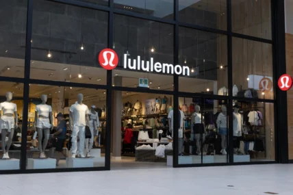 Lululemon storefront with large glass windows showcasing athletic apparel and mannequins inside a modern retail store.