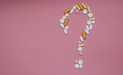 supplement pills form a question mark