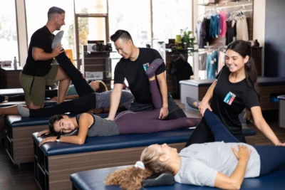 an image of clients receiving assisted stretches from StretchLab