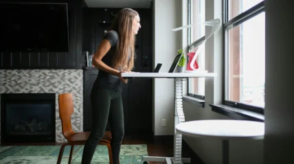 woman works at a standing desk